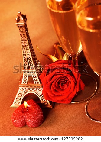 Photo of two glass of champagne on the table in restaurant, festive romantic still life, alcoholic beverage, red rose and candle, wedding day, honeymoon in Paris, travel to France, Valentine day
