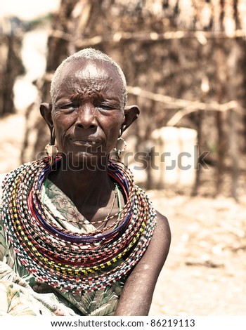 SAMBURU, KENYA - NOVEMBER 8: Unidentified African tribal lady,wears handmade cultural accessories for traditional dance on November 8, 2008 in tribal village, Samburu National Park Reserve, Kenya.