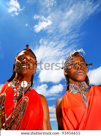MASAI MARA, KENYA - NOVEMBER 12: portrait of an African Masai men, warriors wear  cultural accessories for traditional dance on Nov 12, 2008 in tribal village,Masai Mara National Park Reserve, Kenya.