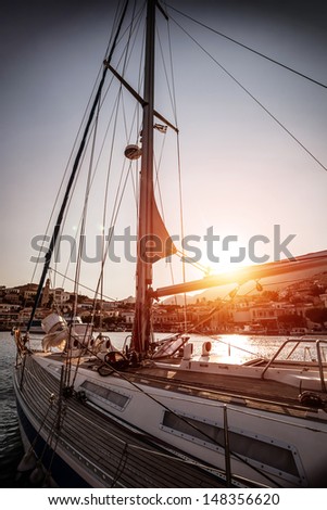 Luxury sailboat on sunset, old harbor in beautiful European city, water transport, sea cruise, summer vacation, travel and tourism concept