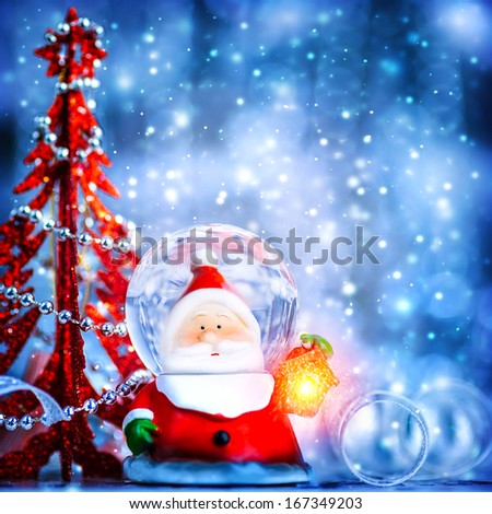 Blue Christmas background with cute snow globe Santa Claus border over blur bokeh lights, magic of Christmas eve and winter holidays, Xmas greeting card