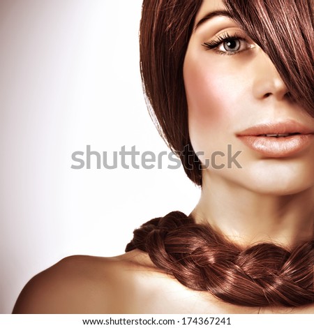 Closeup portrait of gorgeous young lady with beautiful long brown hair, natural haircare, stylish braid hairstyle, luxury hairdressing salon