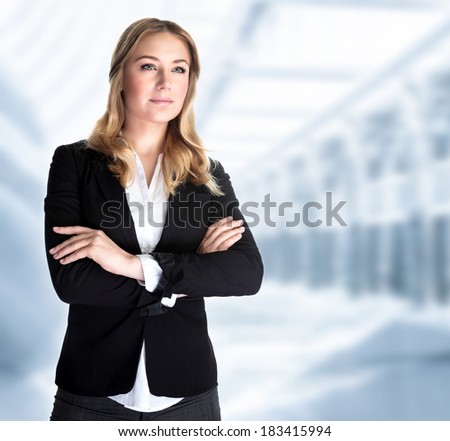 Serious business woman in the office, modern building of great corporate, successful career, smart girl working in luxury business center