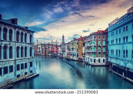 Beautiful Venice city in overcast weather, wonderful water channel between gorgeous colorful medieval buildings, travel to Italy