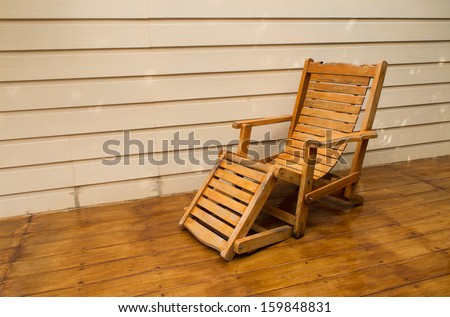 Adirondack wood chairs on a cabin porch