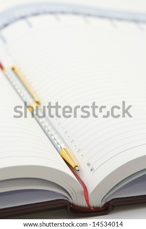 business book with pen
