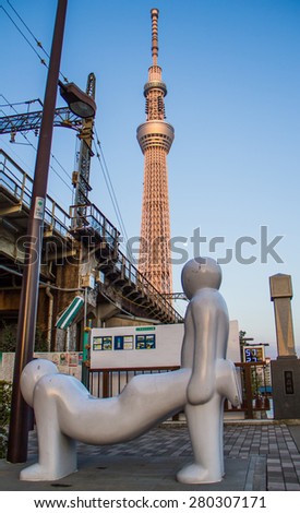 TOKYO,JAPAN-APRIL 2 :Human chair with  Tokyo sky tree background  in Tokyo,Japan shoot on  April 2,2015.Toky sky tree is the tallest building in Japan.