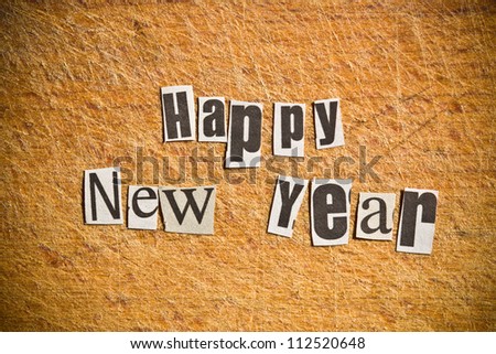 New Year wishes. Shot with newspaper letters.