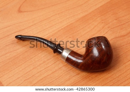 smoking ppipe on wooden background