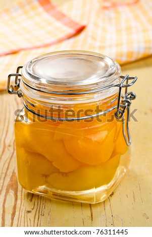 canned peach in glass jar