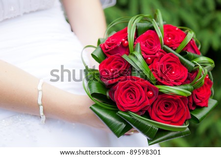 Wedding bouquet of bride\'s hands
