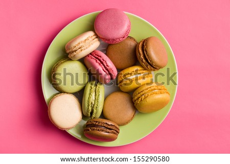 colorful macaroons on pink background