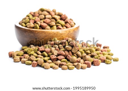 Dry kibble animal food. Dried food for cats or dogs isolated on white background. Сток-фото © 
