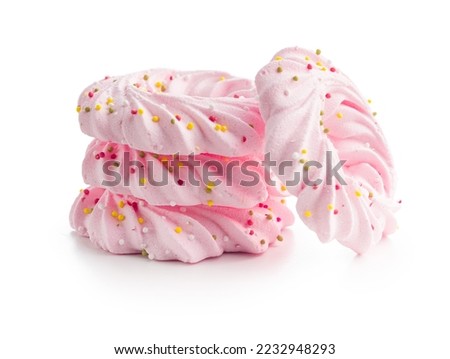 Pink sweet meringues with sprinkles isolated on the white background. Foto d'archivio © 