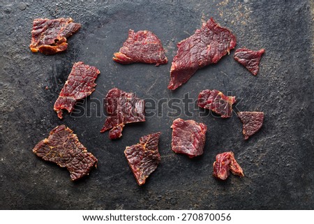 the beef jerky on old black table