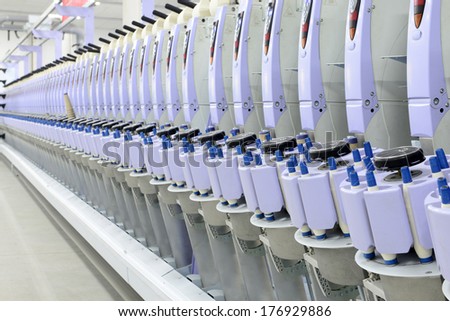 LUANNAN county - December 13: working spinning machine in the production workshop, ZeAo spinning co., LTD., on December 13, 2013, LUANNAN county, hebei province, China.