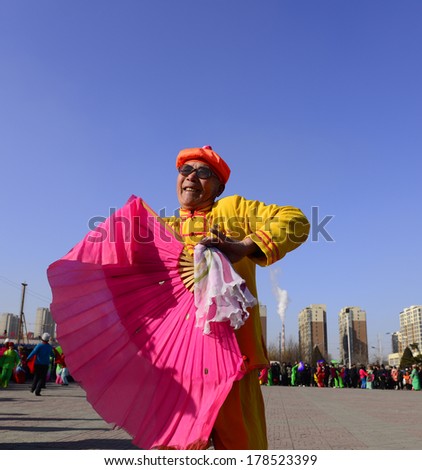 LUANNAN county - Feb. 10: people wearing colorful clothes to yangko dance performances in square, on February 10, 2014, LUANNAN county, hebei province, China.