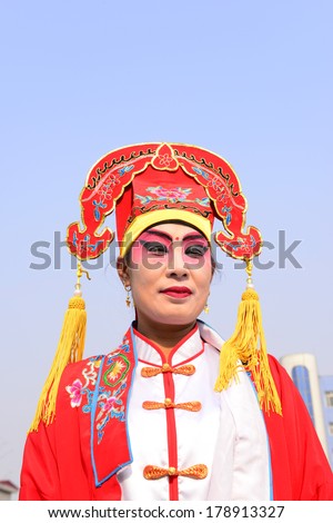 LUANNAN COUNTRY, CHINA - February 12, 2014: people wearing colorful clothes to yangko dance performances in square, hebei province