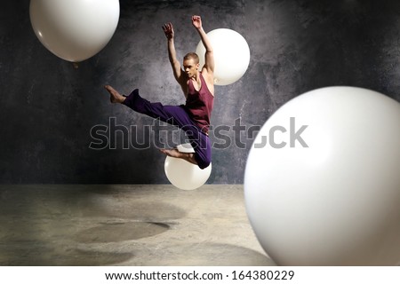 Young dancer is jumping on stage / Dancer in the jump