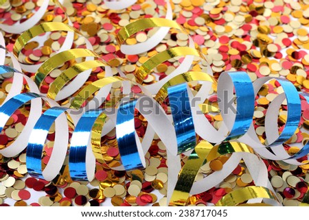 Time of fun, carnival decorations. Shiny, colorful background with confetti spilled