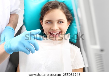 Dentistry, joyful child in the dental chair. Child in the dental chair dental treatment during surgery.