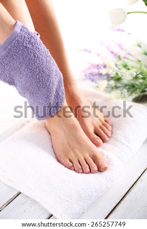 Peeling feet massage sponge.Foot care treatment and nail, the woman at the beautician for pedicure.