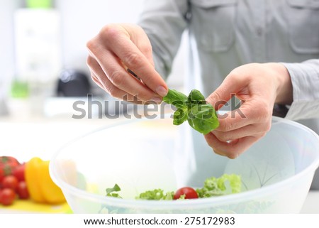 Colourful diet, healthy vegetable salad. Woman hands while preparing colorful salads