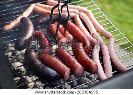 Grilled sausages on the grill. Sausage, blood sausage roasted on the grill garden barbecue