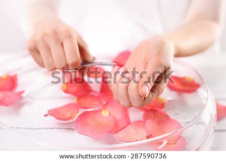 Manicure, nail clipping. The woman cuts the nails, manicure home