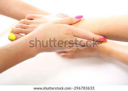Care treatment, relaxing foot massage. Beautician massaging woman\'s foot, acupressure treatment