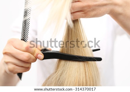 In the hair salon, haircut. Barber haircut  woman with a knife chinese in a hair salon