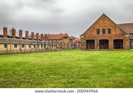 Chimneys and the barracks of the German Nazi concentration camp in Polish