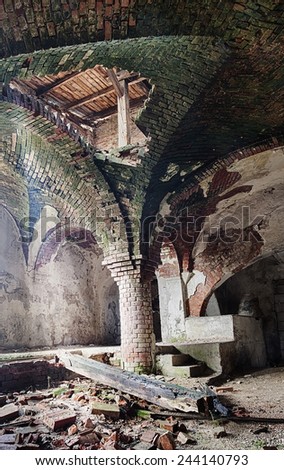 Deserted medieval church basement, with brick arches