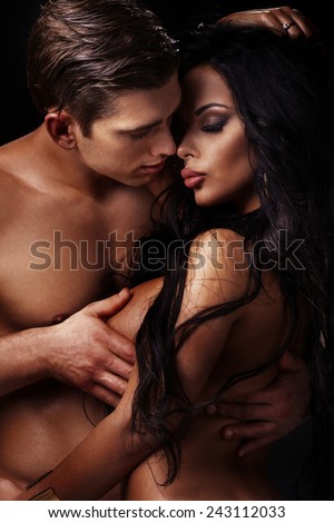 Emotional portrait of attractive couple. Handsome man and sexy woman posing together.