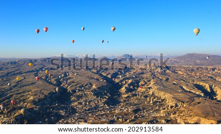 CAPPADOCIA, TURKEY - Mar 5,2014: Cappadocia landscape view and hot air balloon. Hot air balloon is one of the most famous activity that journey have to do in Cappadocia.