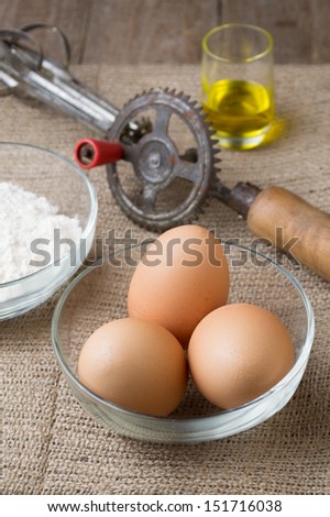 Natural ingredients: eggs, flour, oil. Short depth-of-field.