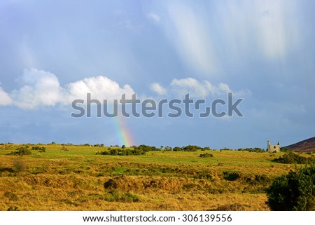 A partial rainbow and panorama view of Bodmin Moor, the ruins of a Cornish Tin Mine, Houseman\'s Engine House can be seen in the distance, at Minions on Bodmin Moor in Cornwall, United Kingdom