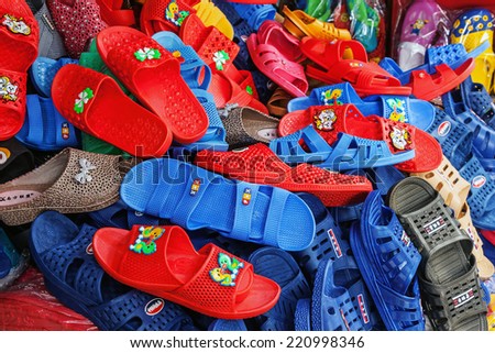 CHONGQING, CHINA - SEPTEMBER 2, 2014: colored shoes of Chinese production at a local store of Chongqing, China on September 2, 2014. China is a major producer and exporter of footwear in the world.