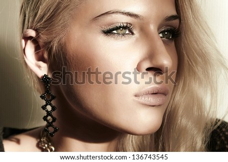 face of beautiful blond woman. shade from the sun. daylight