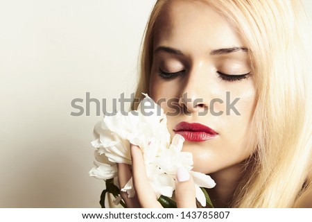 beautiful blond woman with white flower. your text here