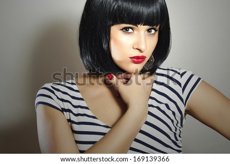 Beautiful Brunette Girl in Dress. Black Hair. bob Haircut. Red Lips. Beauty Woman with Fringe
