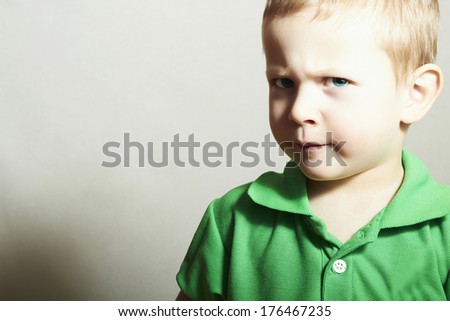 Child. Little Boy with Blue Eyes. Close-up Portrait of Funny Kid.Children emotion