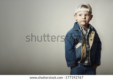 Child. Funny Little Boy in Jeans. Trucker cap. joy. Fashionable Kid 4 years old. plaid shirt. Denim Wear