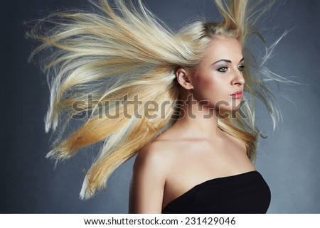 beautiful woman. Sexy blond girl.healthy hair.Beauty salon.flying hair