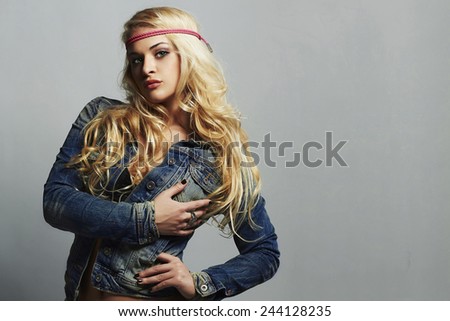 hippie girl. fashion portrait of beautiful woman in jeans. denim jeans wear.blond Sexy woman