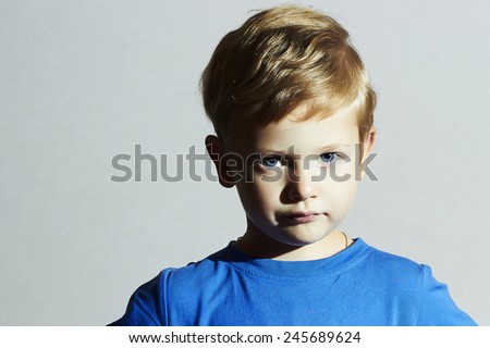 serious Child.funny child Little Boy with Blue Eyes.Children emotion