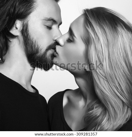 Kissing couple.romantic beautiful woman and handsome man.monochrome portrait of lovely boy and girl