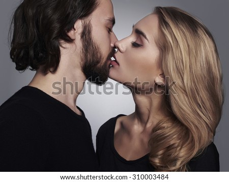 Kissing couple portrait.romantic beautiful woman and handsome man.lovely boy and girl