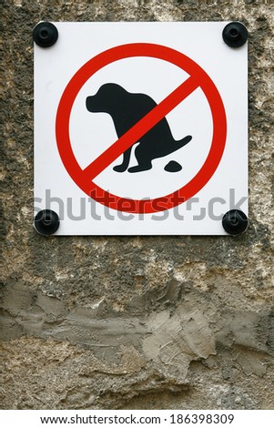 No Dog Pooping fouling sign isolated on wall background