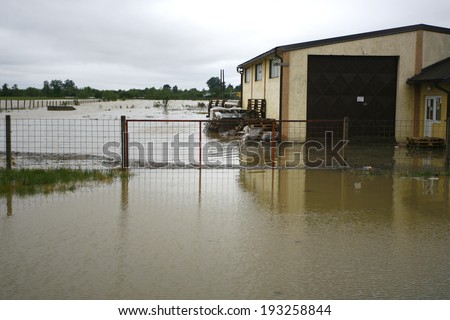 SERBIA, SREMSKA MITROVICA - MAY 17: House stands alone in a flooded area. The water level of Sava River remains high in worst flooding on record across the Balkans on may 17, 2014